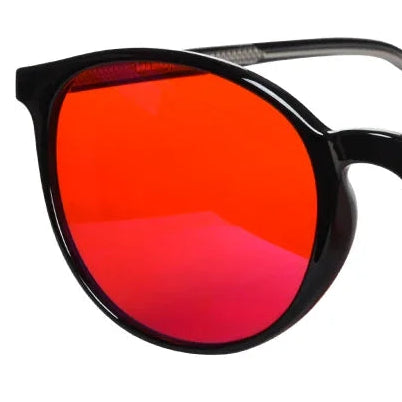 Salutive red-tinted blue light glasses, round frame on a white background