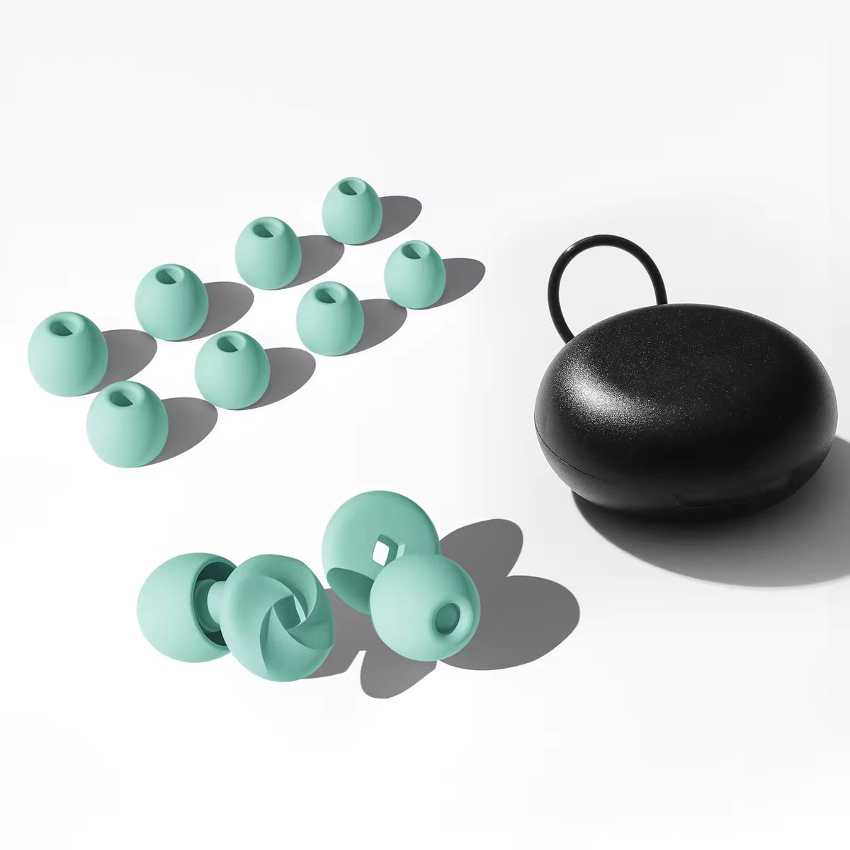 Salutive silicone ear plugs and case with interchangeable tips laid out